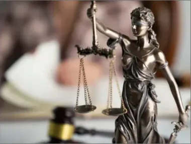 Lady Justice statue with gavel