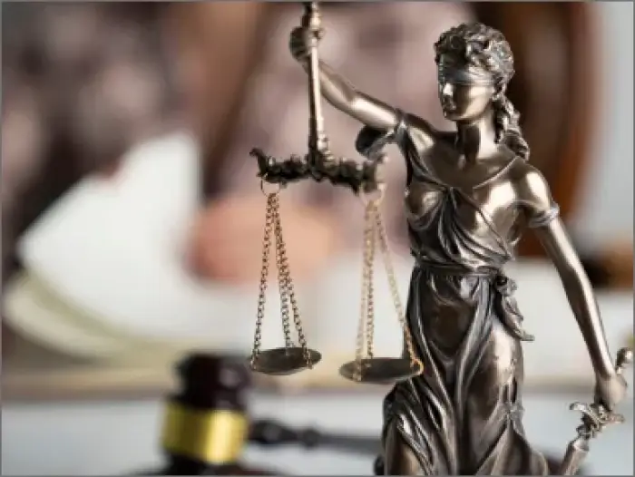Lady Justice statue with gavel