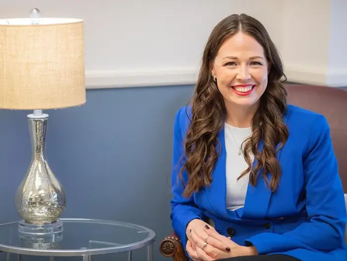Smiling woman in bright blazer